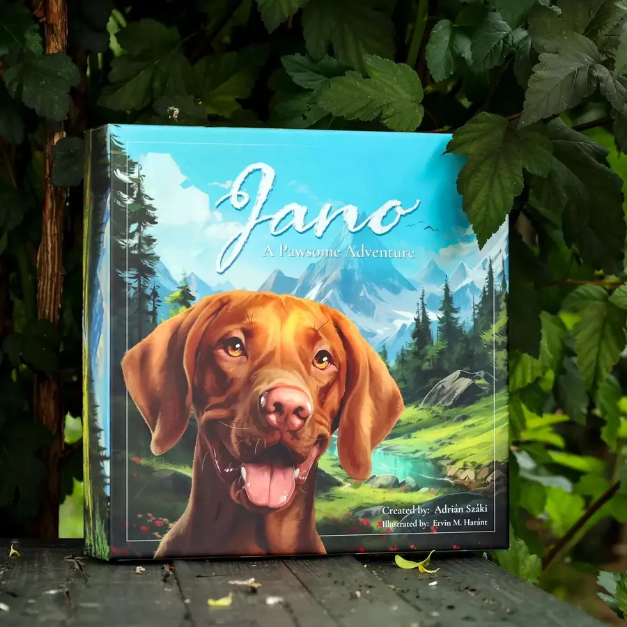 Jano – A Pawsome Adventure: Spielschachtel mit Vizsla-Illustration, im Grünen aufgestellt